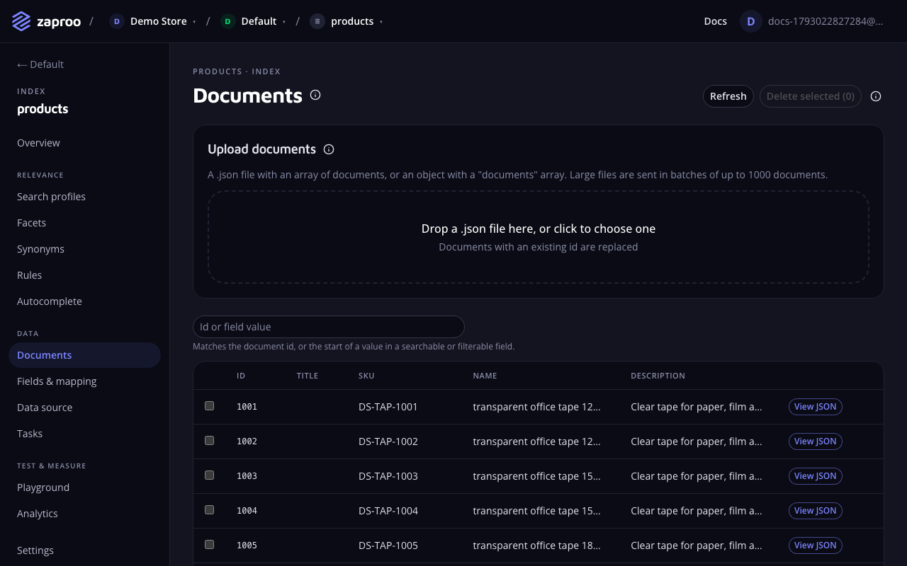 The Documents page with a drop zone for a JSON file, a search box and a table of documents with id, SKU, name and a View JSON link