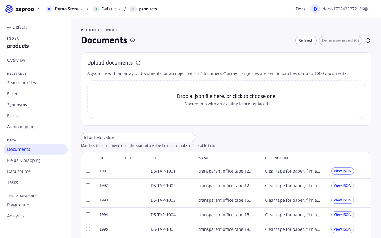 The Documents page with a drop zone for a JSON file, a search box and a table of documents with id, SKU, name and a View JSON link